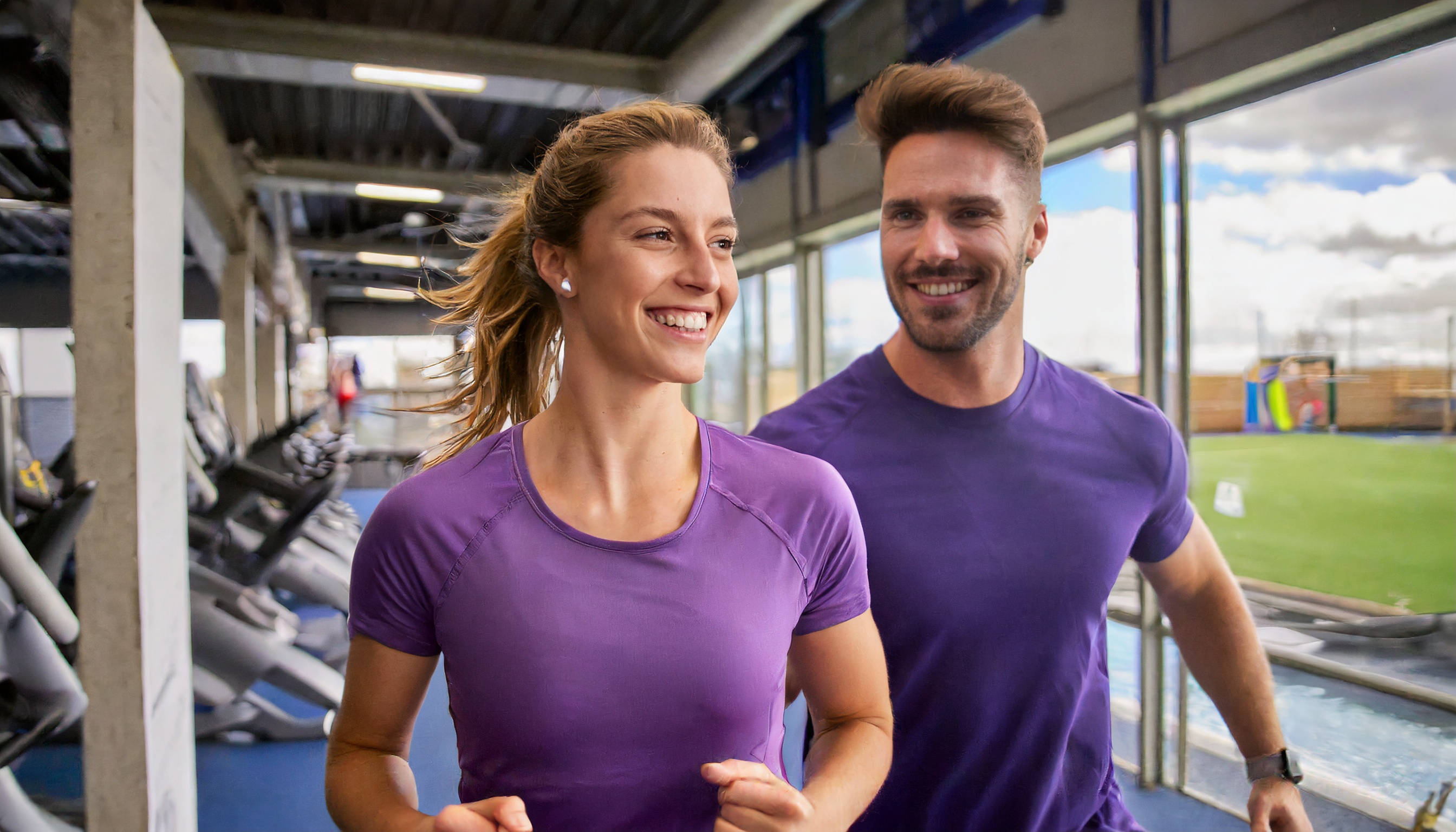Firefly_happy__smiling_male_and_female_exercisers_coming_out_of_a_gym__purple_clothing_88038.jpg